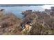 Aerial view of a lakefront house with a spacious lot and stunning water views at 3830 Mill Run, Terrell, NC 28682