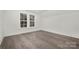 Charming bedroom with large windows and wood floors at 3830 Mill Run, Terrell, NC 28682