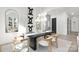 Modern dining room with black table, white chairs, and statement art at 3830 Mill Run, Terrell, NC 28682