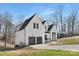 Two-story white house with dark gray roof and a two-car garage at 3830 Mill Run, Terrell, NC 28682
