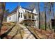 Stunning exterior of a modern farmhouse-style home with a welcoming back porch on a landscaped lot at 3830 Mill Run, Terrell, NC 28682