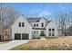 Two story modern farmhouse with dark gray accents and attached two car garage at 3830 Mill Run, Terrell, NC 28682