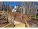 Charming home on a hillside with beautiful stone staircase and waterfront access through the trees at 3830 Mill Run, Terrell, NC 28682