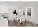 Bright kitchen with white cabinets, quartz countertops, and stainless steel appliances at 3830 Mill Run, Terrell, NC 28682