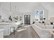Modern kitchen with white cabinets, island, and stainless steel appliances at 3830 Mill Run, Terrell, NC 28682