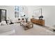 Living area with a cozy sitting area and large windows overlooking a lake at 3830 Mill Run, Terrell, NC 28682