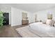Bright main bedroom featuring hardwood floors, neutral decor, and a large window at 3830 Mill Run, Terrell, NC 28682