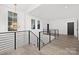 Elegant upper hallway with wood floors and black doors at 3830 Mill Run, Terrell, NC 28682