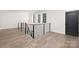 Stylish upper hallway with wood floors and metal railing at 3830 Mill Run, Terrell, NC 28682