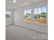 Well-lit bedroom with large windows overlooking the neighborhood at 4121 Walking Ridge Rd # 54, Charlotte, NC 28208