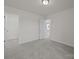 Cozy bedroom features carpet, neutral walls, and access to a closet and bathroom at 4121 Walking Ridge Rd # 54, Charlotte, NC 28208