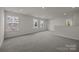 Bright bonus room featuring windows and neutral carpet at 4121 Walking Ridge Rd # 54, Charlotte, NC 28208