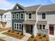 New construction townhome featuring a stylish exterior with a covered entryway and modern finishes at 4121 Walking Ridge Rd # 54, Charlotte, NC 28208