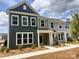 Charming two-story townhome featuring a welcoming front porch and a combination of vertical and horizontal siding at 4121 Walking Ridge Rd # 54, Charlotte, NC 28208