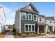 Charming two-story townhome with a modern gray exterior and well-manicured landscaping at 4121 Walking Ridge Rd # 54, Charlotte, NC 28208