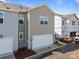 A spacious two-car garage in a modern townhome with sleek gray siding at 4121 Walking Ridge Rd # 54, Charlotte, NC 28208
