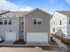 New construction townhome with a two-car garage and modern gray siding at 4121 Walking Ridge Rd # 54, Charlotte, NC 28208