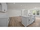 Open-concept kitchen featuring an island with sink and stainless steel appliances at 4121 Walking Ridge Rd # 54, Charlotte, NC 28208
