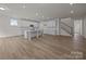 The open-concept kitchen boasts bright white cabinetry, a center island, and modern appliances at 4121 Walking Ridge Rd # 54, Charlotte, NC 28208