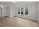 Spacious living room with hardwood flooring, ample natural light, and neutral color palette at 4121 Walking Ridge Rd # 54, Charlotte, NC 28208