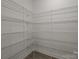 Walk-in pantry featuring ample shelving with metal racks for organized storage at 4121 Walking Ridge Rd # 54, Charlotte, NC 28208