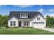 Charming farmhouse exterior with a two-car garage and landscaped yard at 4165 Eastover Glen Rd # 0337, Charlotte, NC 28269