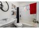 Clean bathroom, featuring a bathtub and shelving at 437 Brevard St, Statesville, NC 28677