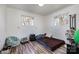 Simple bedroom with wood floors and two windows at 437 Brevard St, Statesville, NC 28677