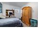 Simple bedroom with wood floors, a double bed, and a large wardrobe at 437 Brevard St, Statesville, NC 28677