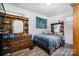 Cozy bedroom with wood floors, a double bed, and built-in shelving at 437 Brevard St, Statesville, NC 28677