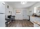 View of kitchen with white cabinets, wood flooring, and a full suite of appliances at 437 Brevard St, Statesville, NC 28677