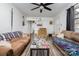Living room with couches, coffee table, and ceiling fan at 437 Brevard St, Statesville, NC 28677