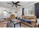 Living room with couches, coffee table, and ceiling fan at 437 Brevard St, Statesville, NC 28677