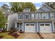 Two-story home with gray and blue siding and two-car garage at 5315 Kelly St # A, Charlotte, NC 28205