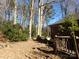 Wooded backyard with a brick home in view at 5514 Grafton Pl, Charlotte, NC 28212