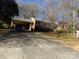 Brick ranch house with carport and driveway at 5514 Grafton Pl, Charlotte, NC 28212