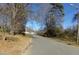 Residential street lined with trees and homes at 5514 Grafton Pl, Charlotte, NC 28212