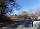 Residential street view with mature trees and homes visible at 5514 Grafton Pl, Charlotte, NC 28212
