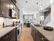 Modern kitchen featuring sleek countertops and stainless steel appliances at 5608 Kingspan Dr, Charlotte, NC 28217