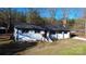 Aerial view of a renovated white ranch house with a carport and shed at 6726 Lockhart Rd, Sharon, SC 29742