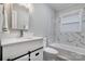 Bathroom featuring modern vanity and sink, updated fixtures, and stylish tile backsplash at 6726 Lockhart Rd, Sharon, SC 29742