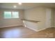 Bedroom with new laminate flooring, natural light from the double windows, and a long wooden desk at 6726 Lockhart Rd, Sharon, SC 29742