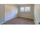 This bedroom features wood-look flooring, a window with natural light and closet with panel doors at 6726 Lockhart Rd, Sharon, SC 29742