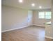 Bedroom with new laminate flooring, natural light from the double windows, and modern trim at 6726 Lockhart Rd, Sharon, SC 29742