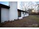 White brick home with black window frames and a spacious backyard at 6726 Lockhart Rd, Sharon, SC 29742
