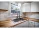 Renovated kitchen with butcher block countertops and white cabinets at 6726 Lockhart Rd, Sharon, SC 29742