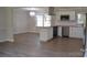 Modern kitchen featuring stainless appliances, butcher block countertops, and new laminate flooring at 6726 Lockhart Rd, Sharon, SC 29742