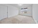 Bright bedroom with neutral carpeting and large window at 800 Landau Rd, Waxhaw, NC 28173