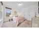Cozy bedroom with carpeted floor and large windows at 800 Landau Rd, Waxhaw, NC 28173