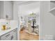 Butlers pantry with white cabinets and quartz countertops, offering extra storage at 800 Landau Rd, Waxhaw, NC 28173